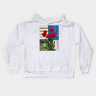 Red Tulips in front of a Blue Door Kids Hoodie